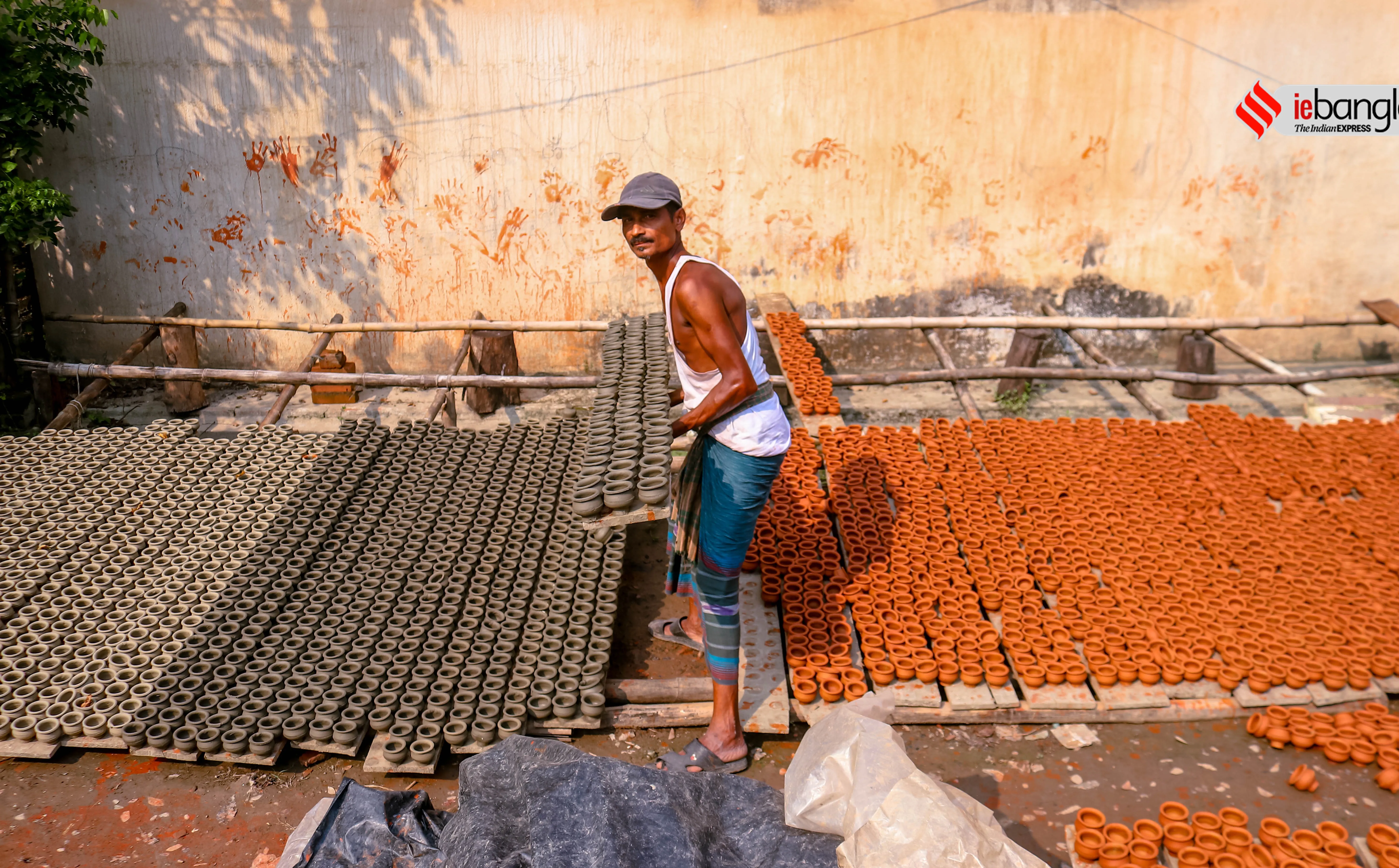 earthen lamps, মাটির প্রদীপ, diya, দীপাবলি, Diwali, আলোকসজ্জা, festival, প্রদীপ, potters, Diwali 2021, কালীপূজা, Hindu festival, মৃৎশিল্পী, মাটির প্রদীপ, diya, দীপাবলি, diwali, আলোকসজ্জা, festival, প্রদীপ, potters, diwali 2021, কালীপূজা, hindu festival, মৃৎশিল্পী, প্রদীপের নীচেই অন্ধকার, করোনা, corona, কোভিড-১৯, Covid-19, করোনা মহামারী, Corona Pandemic, ২০২১, প্রদীপ গ্রাম, earthen lamps village, চালতাবেড়িয়া, Chaltaberia, বারাসাত, barasat, বারাসাতের কালীপূজা, Barasat Kalipuja, ভারত-বাংলাদেশ, India-Bangladesh, শিল্পী, artist, কুটির শিল্প, Cottage industry, কুটির শিল্পী, Cottage artist, পশ্চিমবঙ্গের কুটির শিল্প, Cottage industry in West Bengal, ইন্ডিয়া রেকর্ড, India Record, West Bengal news, indian express, কলেজ স্ট্রিট, college street, করোনা, corona, corona news, Bangla Khabar, বাংলার খবর, Bangla News Live, বাংলার ব্রেকিং নিউজ, Breaking Bangla News,Bangali news, বাংলায় সর্বশেষ খবর, লেটেস্ট খবর, News in Bengali, Bengali News Today, বাংলা নিউজ, Bengali News, করোনা মহামারী, corona pandemic, Bangla Khabor, কোভিড-১৯, covid, News in Bangla, করোনা ২০২১, corona 2021, 24 Ghanta Bangla News, Bangla News, covid-19