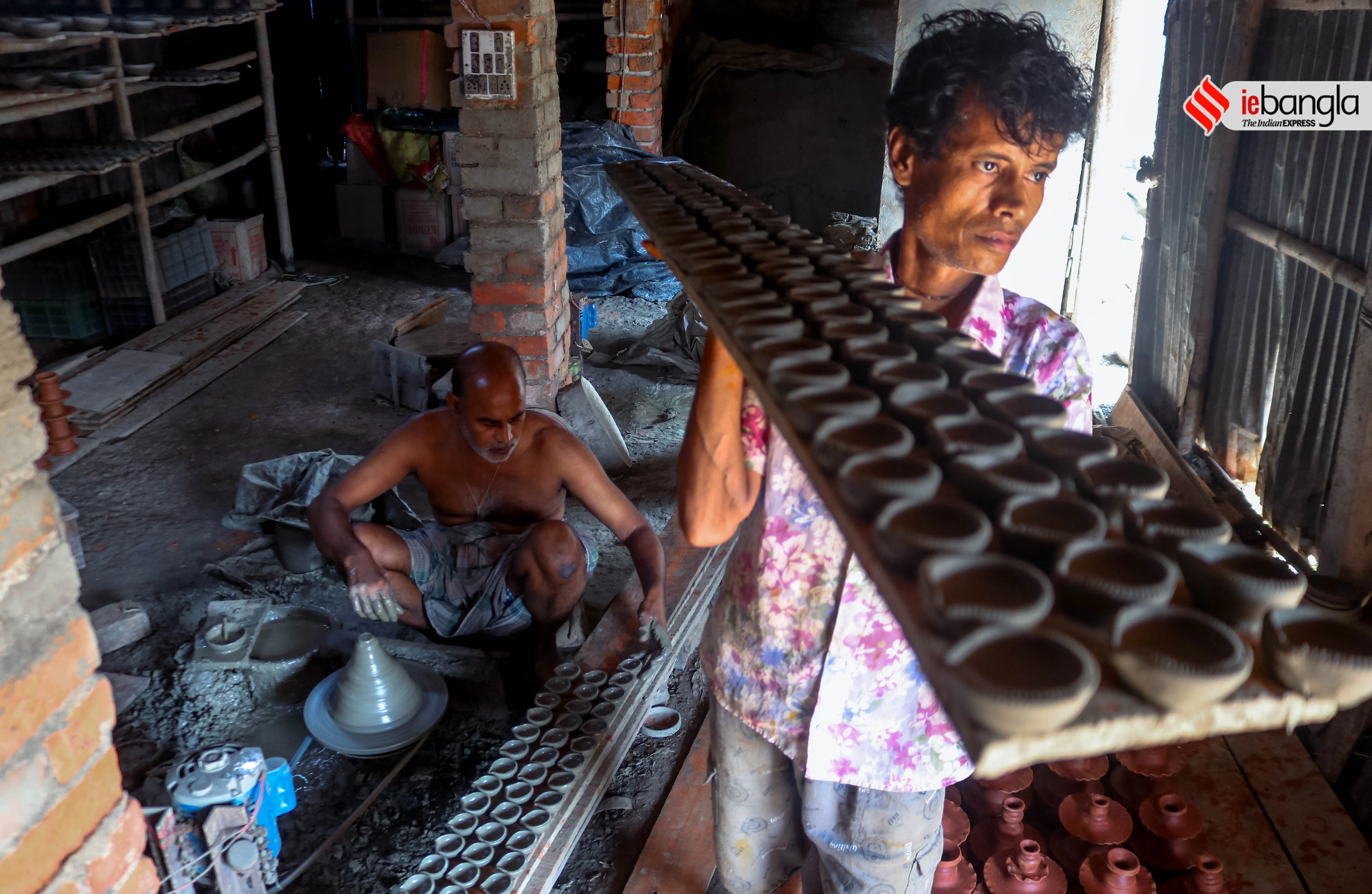 earthen lamps, মাটির প্রদীপ, diya, দীপাবলি, Diwali, আলোকসজ্জা, festival, প্রদীপ, potters, Diwali 2021, কালীপূজা, Hindu festival, মৃৎশিল্পী, মাটির প্রদীপ, diya, দীপাবলি, diwali, আলোকসজ্জা, festival, প্রদীপ, potters, diwali 2021, কালীপূজা, hindu festival, মৃৎশিল্পী, প্রদীপের নীচেই অন্ধকার, করোনা, corona, কোভিড-১৯, Covid-19, করোনা মহামারী, Corona Pandemic, ২০২১, প্রদীপ গ্রাম, earthen lamps village, চালতাবেড়িয়া, Chaltaberia, বারাসাত, barasat, বারাসাতের কালীপূজা, Barasat Kalipuja, ভারত-বাংলাদেশ, India-Bangladesh, শিল্পী, artist, কুটির শিল্প, Cottage industry, কুটির শিল্পী, Cottage artist, পশ্চিমবঙ্গের কুটির শিল্প, Cottage industry in West Bengal, ইন্ডিয়া রেকর্ড, India Record, West Bengal news, indian express, কলেজ স্ট্রিট, college street, করোনা, corona, corona news, Bangla Khabar, বাংলার খবর, Bangla News Live, বাংলার ব্রেকিং নিউজ, Breaking Bangla News,Bangali news, বাংলায় সর্বশেষ খবর, লেটেস্ট খবর, News in Bengali, Bengali News Today, বাংলা নিউজ, Bengali News, করোনা মহামারী, corona pandemic, Bangla Khabor, কোভিড-১৯, covid, News in Bangla, করোনা ২০২১, corona 2021, 24 Ghanta Bangla News, Bangla News, covid-19