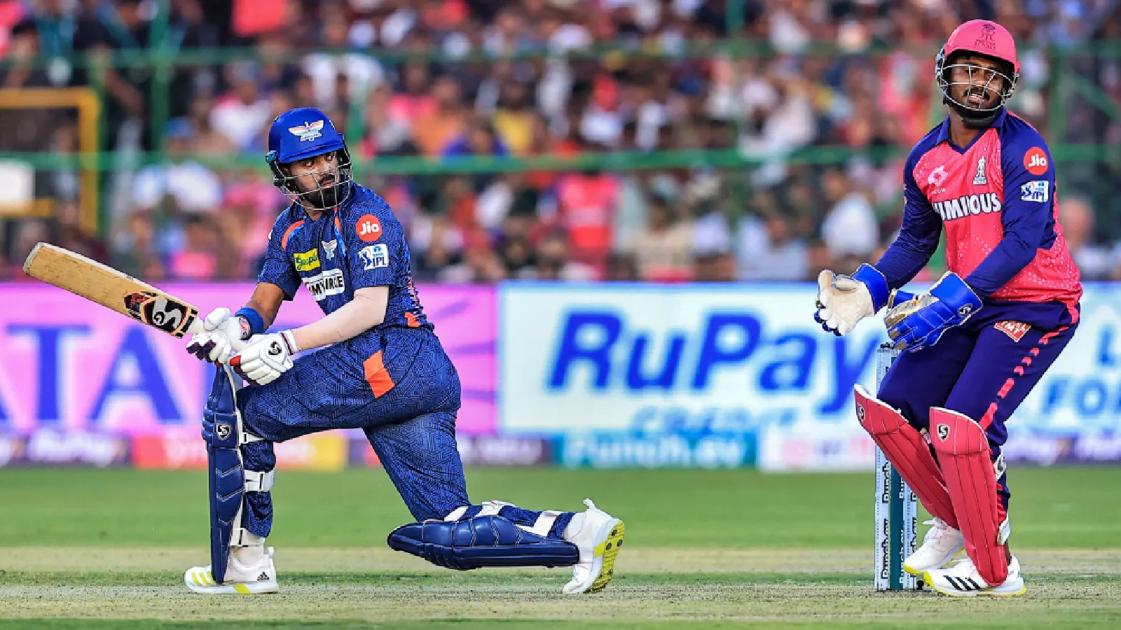 LSG batter KL Rahul plays a shot as Rajasthan Royals keeper Sanju Samson watches during the IPL 2024 T20 match in Jaipur. (PTI Photo)