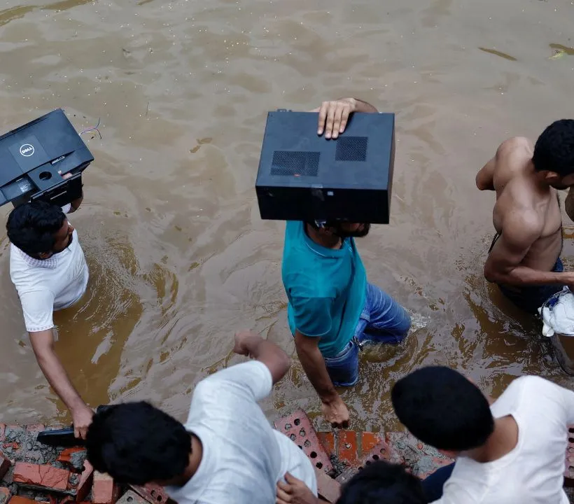 Celebratory crowds were captured on video shouting slogans and marking the fall of Hasina's government. The protesters, who viewed the looting of Ganabhaban as a symbol of victory, were seen carrying out televisions, chairs, and tables.