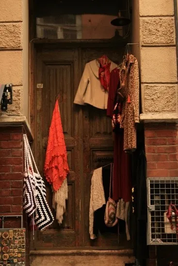 Hanging clothes behind the door