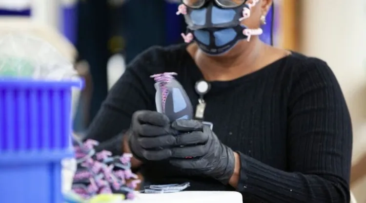 In Lawrence, Mass., the New Balance athletic shoe company is making face masks for healthcare workers after consulting with local physicians and experts at Harvard.