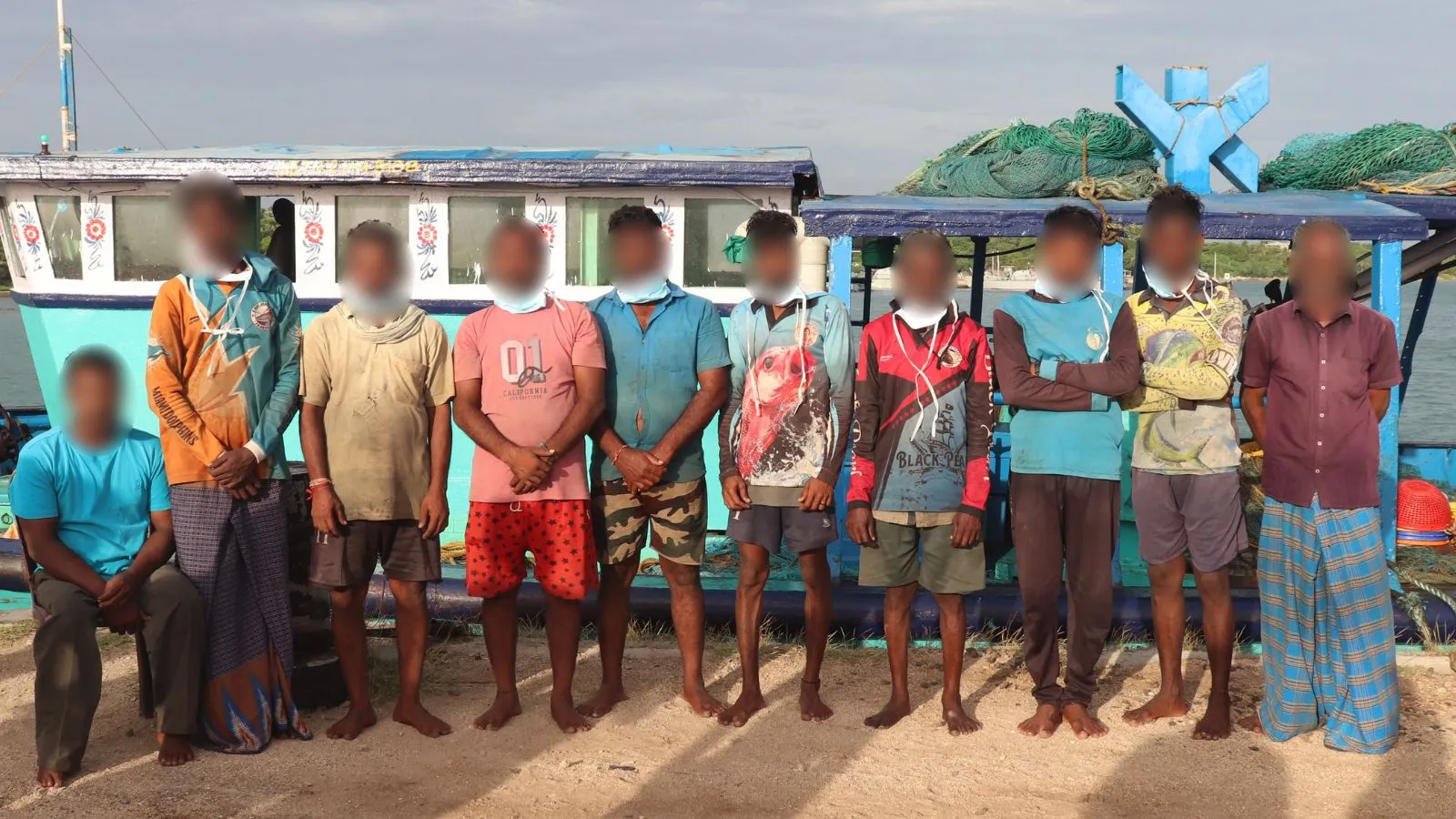 The fishermen were handcuffed and moved to the back of the boat, which was then taken to Kankesanthurai Harbour near Jaffna