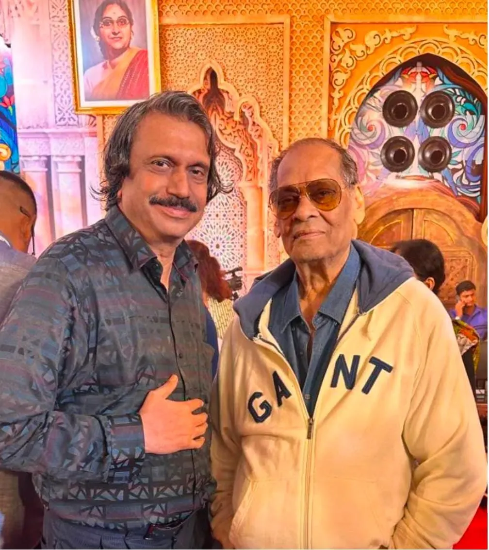 Debu-da Mukherjee (right) with journalist Chaitanya Padukone at North Bombay Durga Pujo (2024)