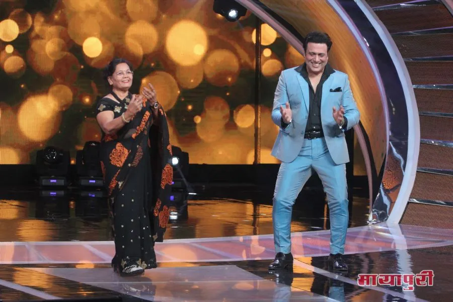 Govinda shaking a leg with a contestants grandmother