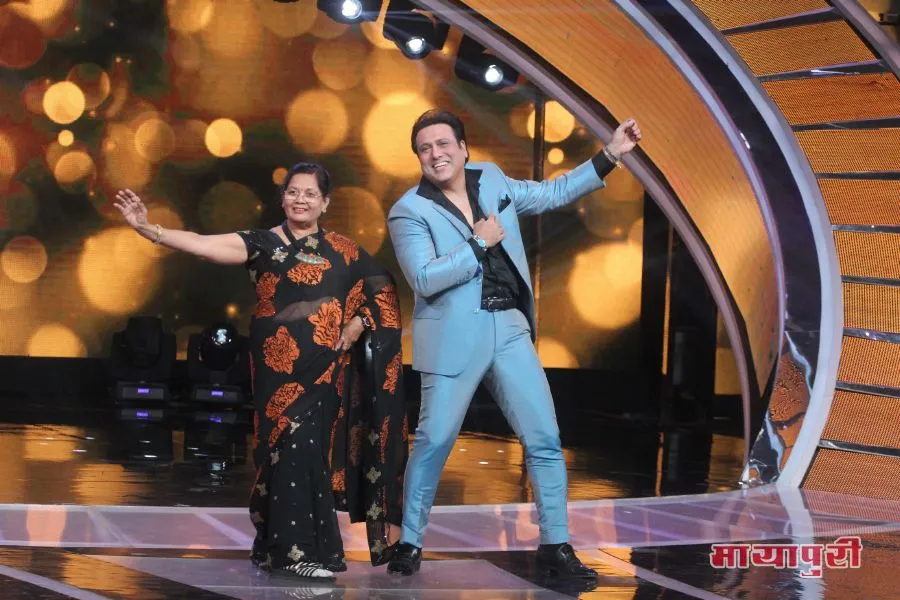 Govinda shaking a leg with a contestants grandmother