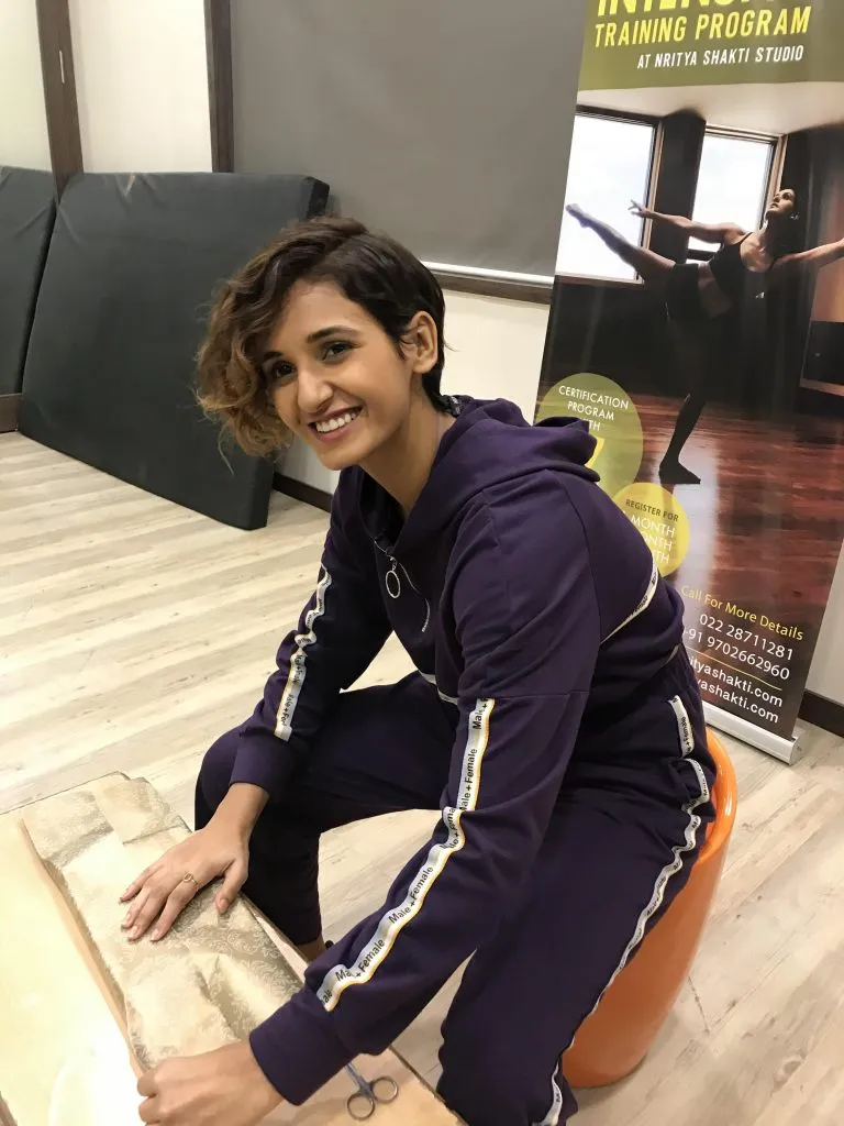 Shakti Mohan wrapping a present for her father