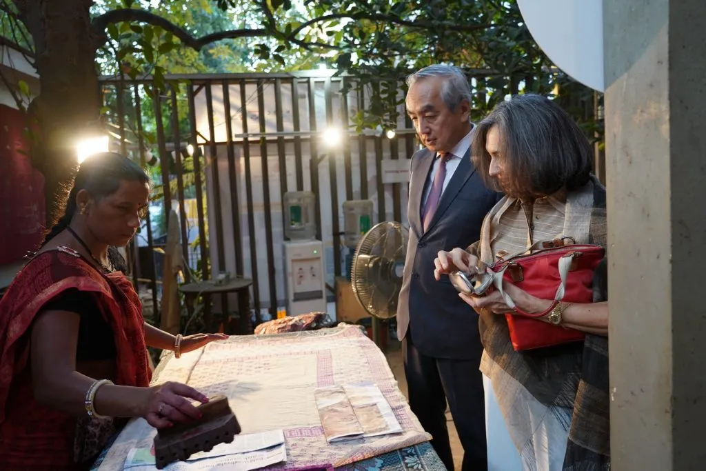 Japanese Ambassador and wife looking at an artisan at work