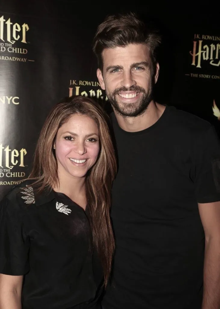 The former couple smile for the camera at a media event