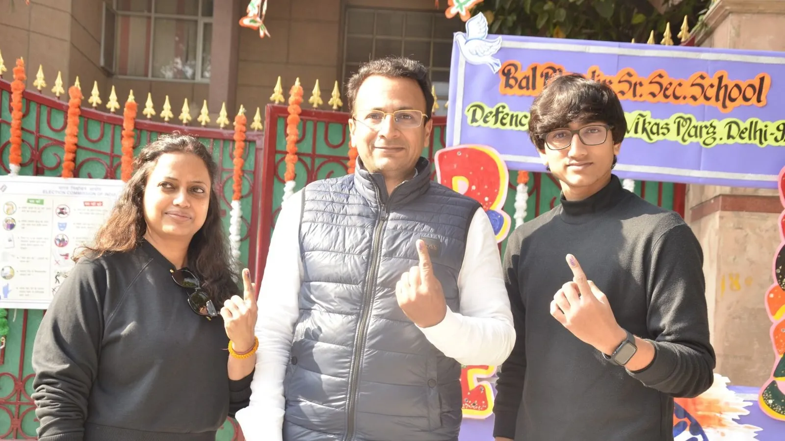 Delhi BJP general secretary Vishnu Mittal shows inked finger after voting with family on Wednesday, Feb 5, 2025.