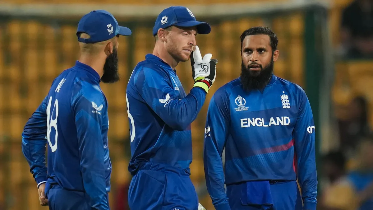 England's captain Jos Buttler with teammates during the ICC Men’s Cricket World Cup 2023 match between England and Sri Lanka, at M. Chinnaswamy Stadium, in Bengaluru, Thursday, Oct. 26, 2023.