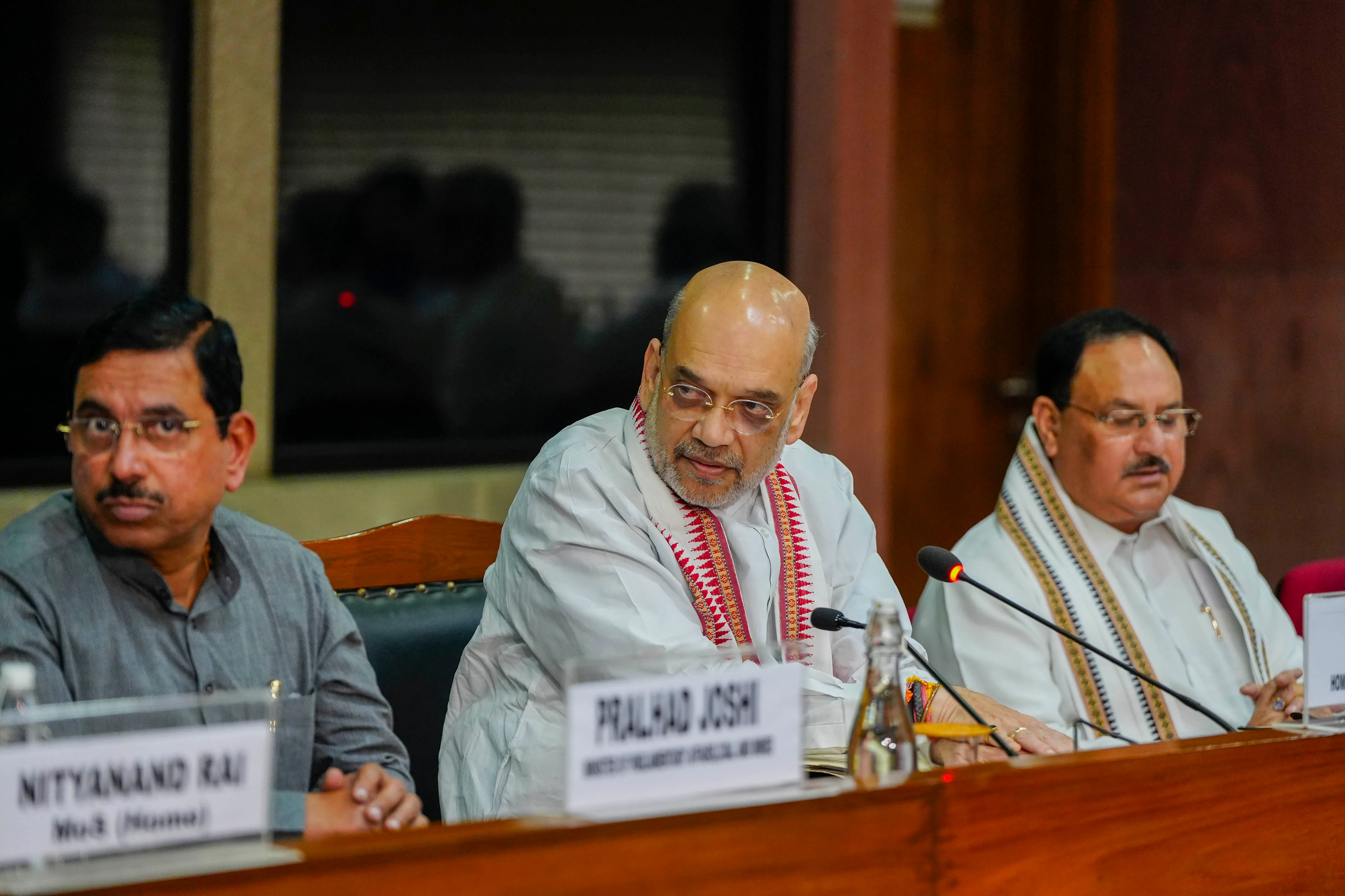 Union Home Minister Amit Shah with Union Minister Pralhad Joshi and BJP National President J.P. Nadda during an all-party meeting on violence in Manipur, in New Delhi