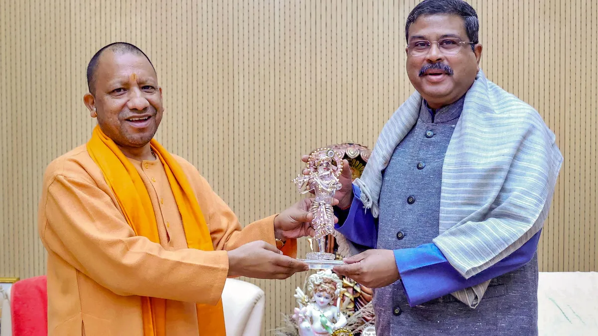 Union Education Minister Dharmendra Pradhan with Uttar Pradesh Chief Minister Yogi Adityanath during a meeting, in Lucknow, Thursday, Jan. 4, 2024.