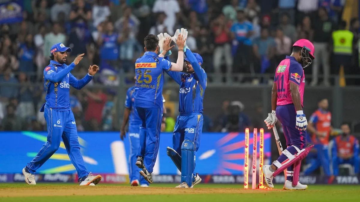 Mumbai Indians bowler Akash Madhwal with teammates celebrates the wicket of Rajasthan Royals batsman Jos Buttler during the Indian Premier League (IPL) 2024 cricket match between Mumbai Indians and Rajasthan Royals, at Wankhede Stadium, in Mumbai, Monday, Apr. 1, 2024.