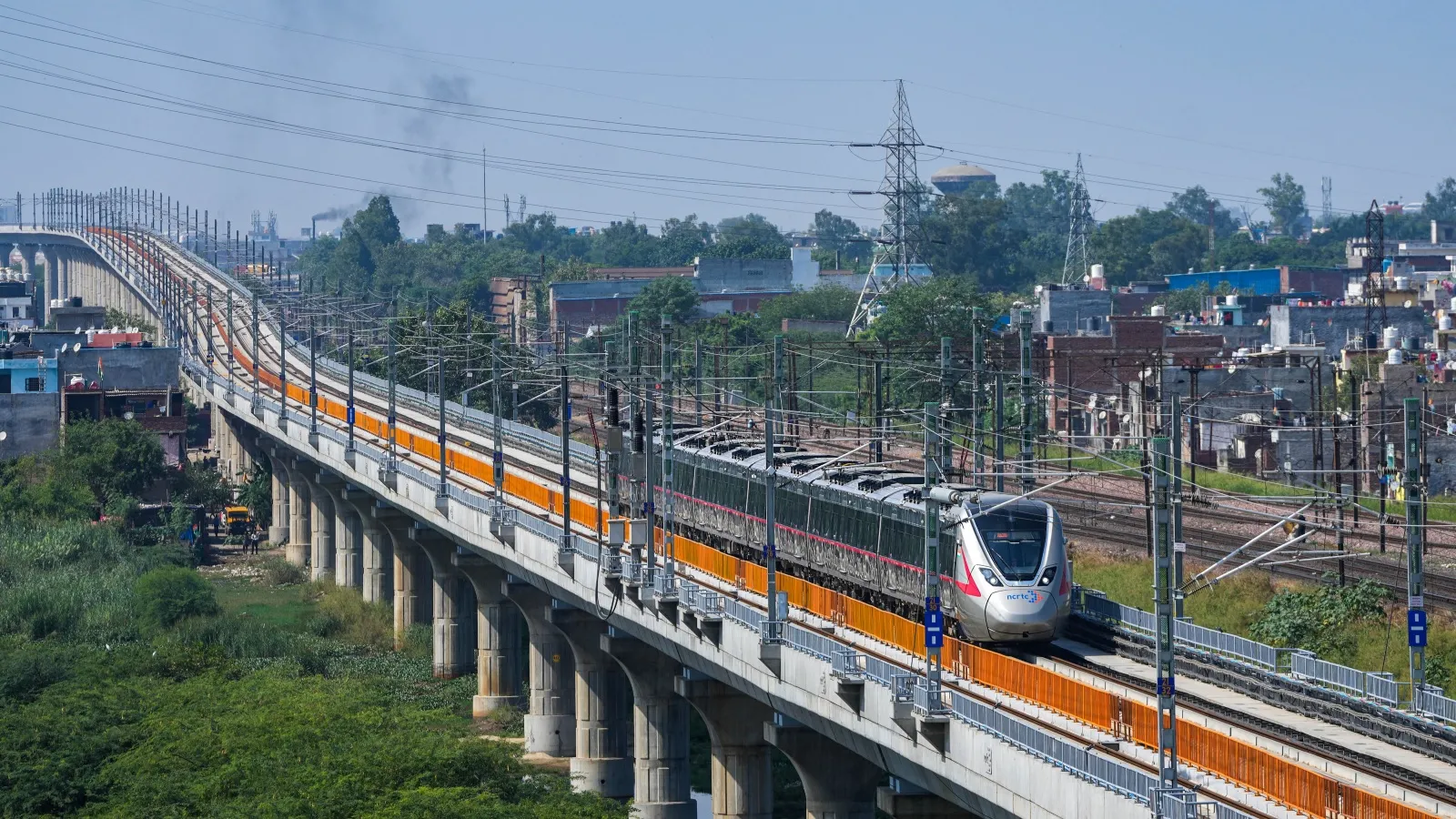 A RAPIDX train runs on its tracks during a media preview ahead of the inauguration of a priority section of the Delhi-Meerut Regional Rapid Transit System (RRTS), in Ghaziabad