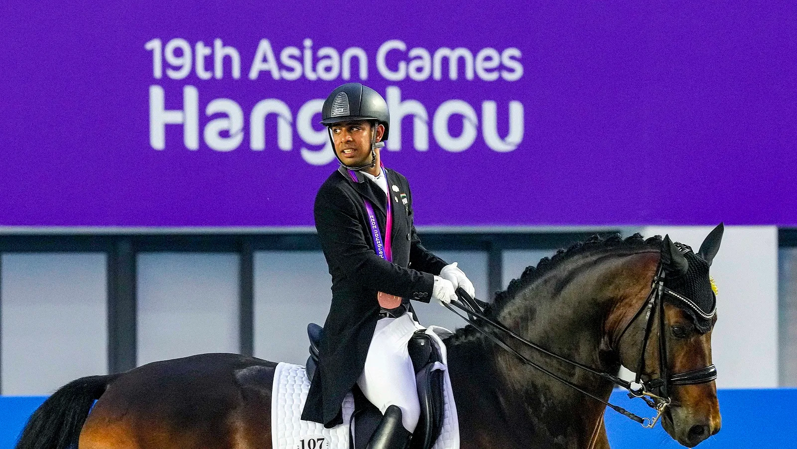 India’s Anush Agarwalla rides his horse Etro as he competes in the Equestrian Dressage Individual Final event at the 19th Asian Games, in Hangzhou, China