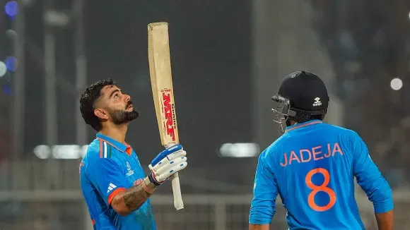 Virat Kohli celebrates after his century during the ICC Men's Cricket World Cup 2023 match between India and South Africa, at Eden Gardens, in Kolkata, Sunday, Nov. 5, 2023. 
