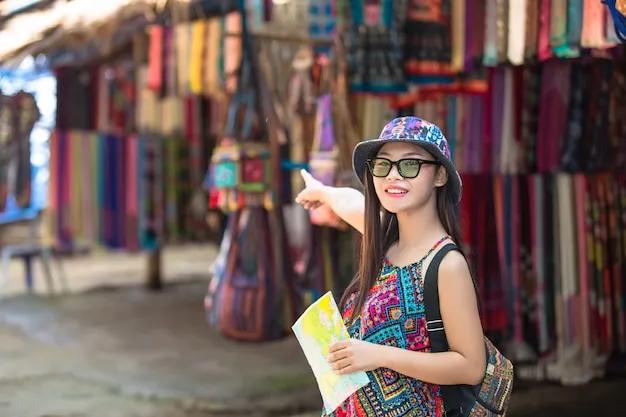 Female tourists on hand have a happy travel map.