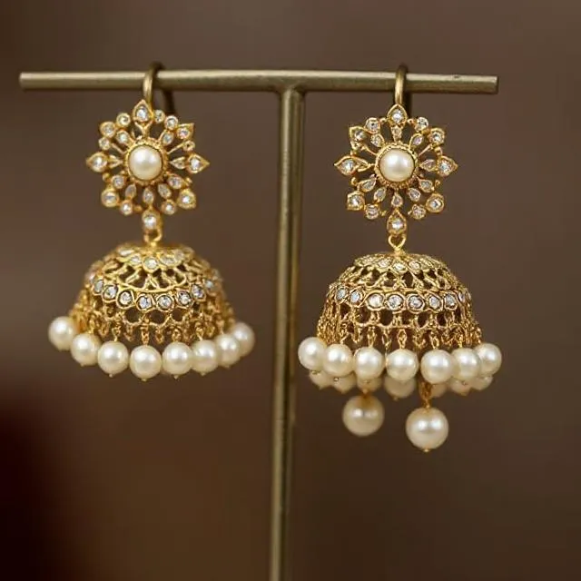 https://images.deepai.org/art-image/f08aa038e9fd4395b6d1fc49e20f0a38/1-kundan-pearl-jhumkis-if-you-want-a-royal-touch-in-y.jpg