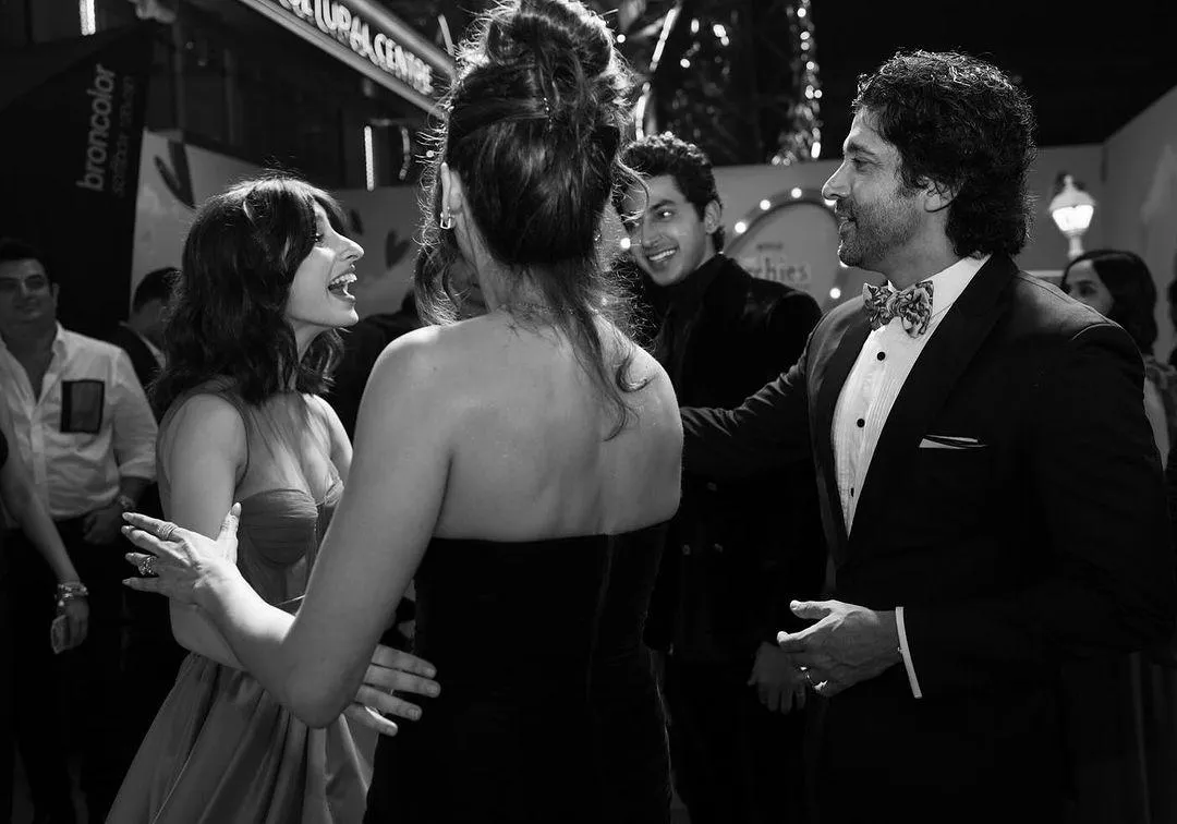 Farhan Akhtar greets Aditi Saigal and Mihir Ahuja in this picture