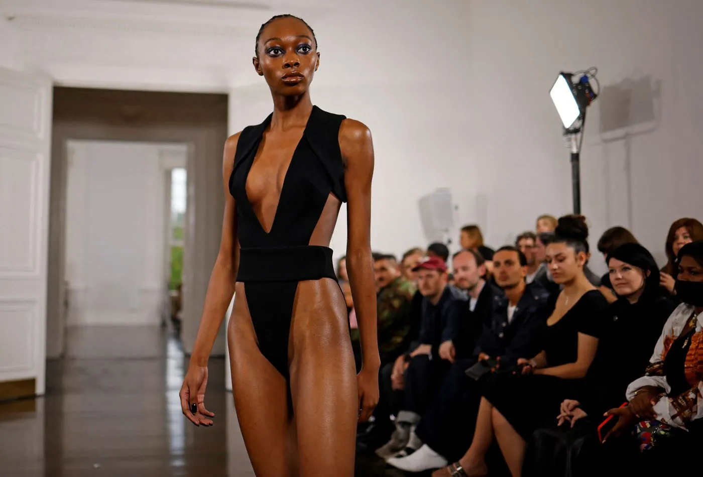 Models present creations during a catwalk show for Fashion East during the Spring/Summer 2022 collection show on the fourth day of London Fashion Week in London on Sept. 20, 2021.