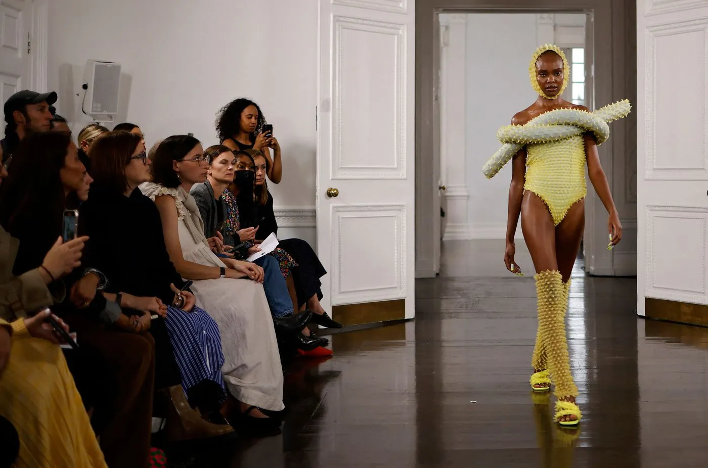 Models present creations during a catwalk show for Fashion East during the Spring/Summer 2022 collection show on the fourth day of London Fashion Week in London on Sept. 20, 2021.