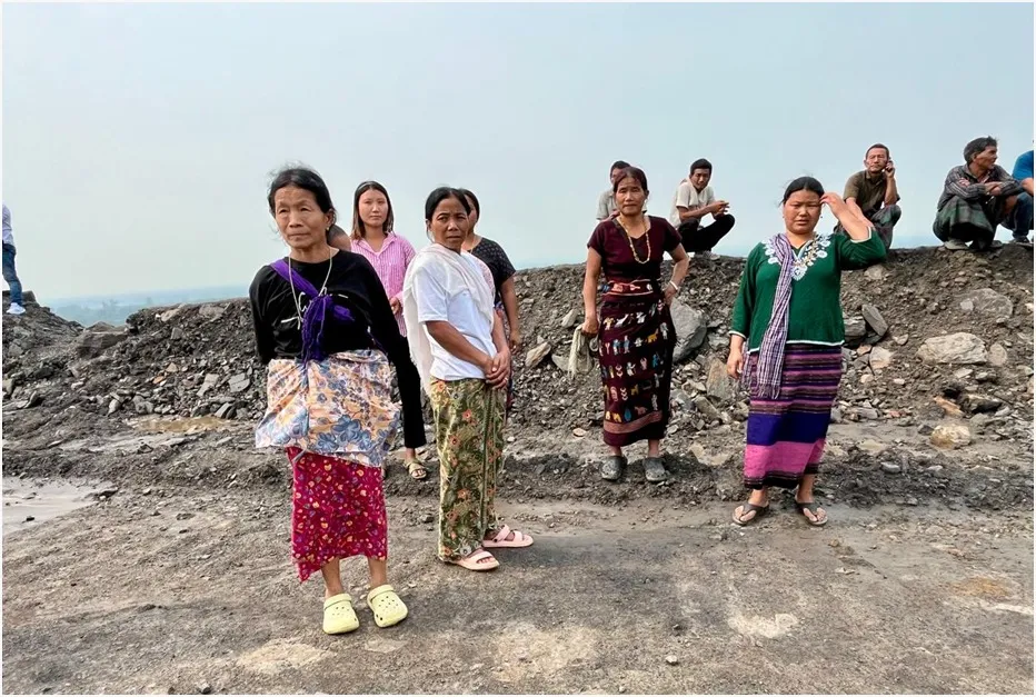 The villagers standing at the top 