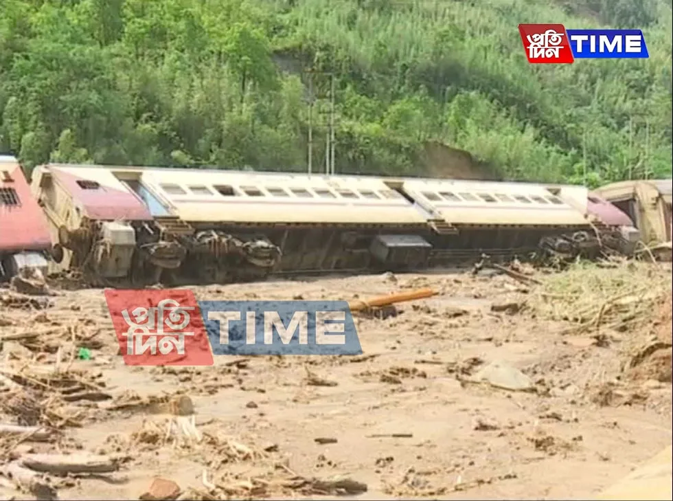 A train turned turtle as railway station inundated with mud   