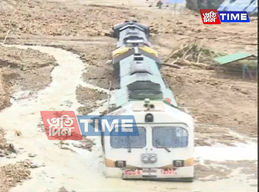 Another scene of a train being completely trapped under debris in New Haflong Railway Station  