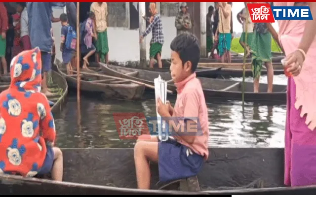 A child holding his books close on his way to the school  