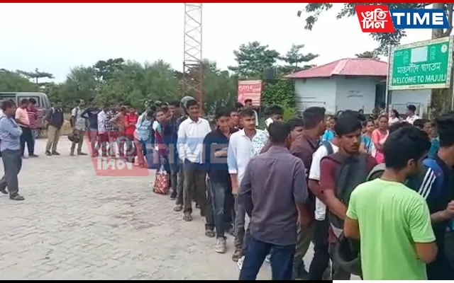 Commuters queue in fron tof ticket counter   