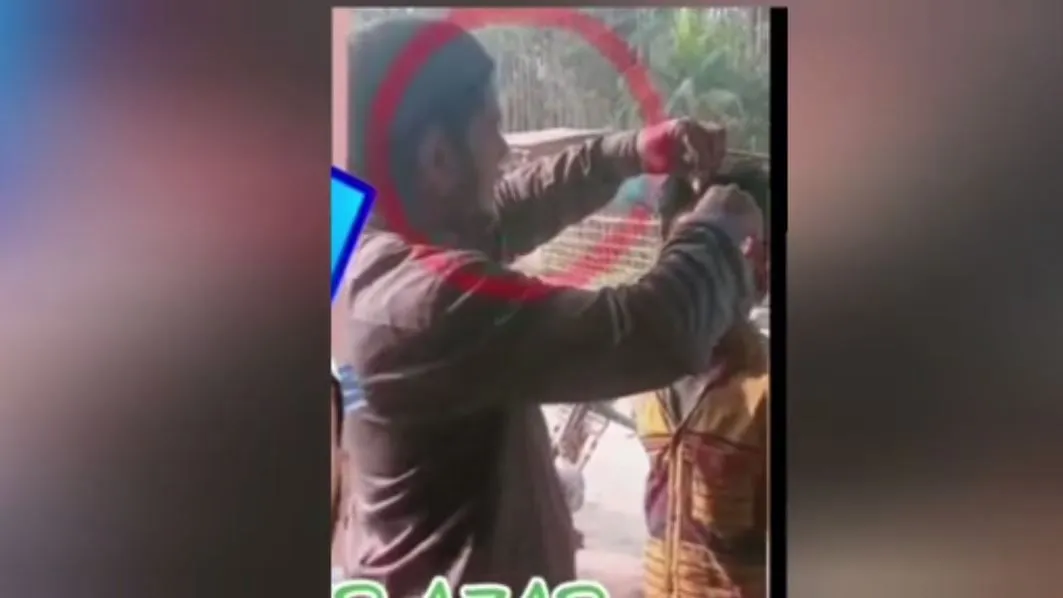 A snap of the video of torturing the minor boy  