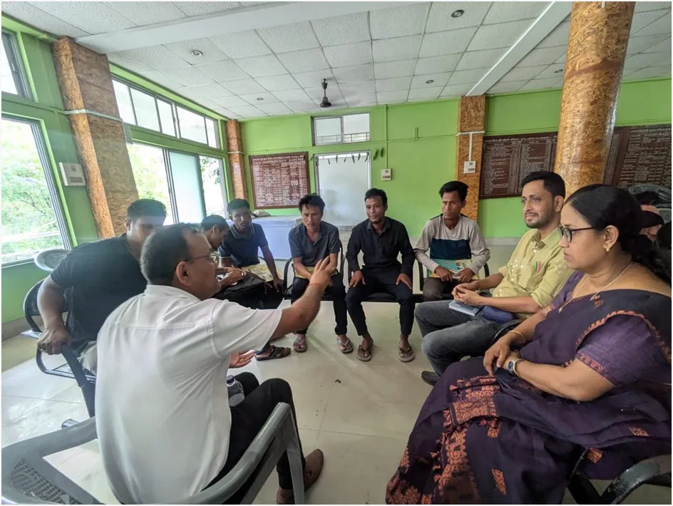 Dr. Bhaktimay Bhattacharjee, DNO, DTCC, Jorhat interacting with the team members of a group and suggesting topics for discussion before the beginning of the group discussion session.  