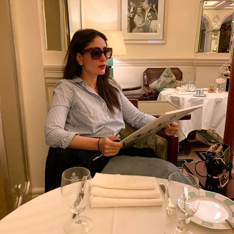 Kareena Kapoor at the hotel with a menu. She is a Foodie but also maintain her fitness even after 40's.  