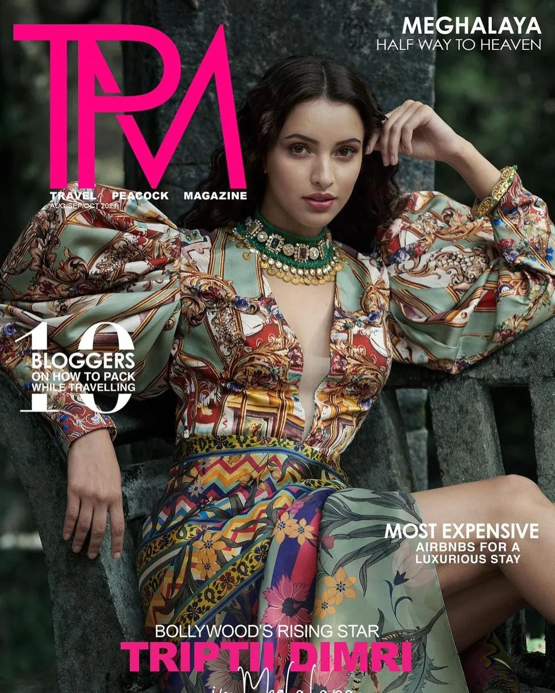The magazine cover for Travel Peacock Magazine features Tripti Dimri in a bold, colorful outfit with a deep neckline and puffed sleeves..jpg  
