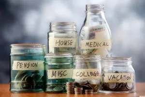 Bottles of cash with coins isolated on the background.  