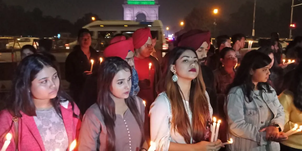 Students take part in lighting candle in front of India Gate on Wednesday  