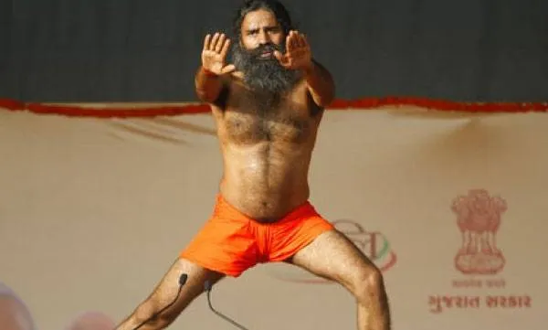 Image result for Baba Ramdev conducts yoga session in Tihar Jail