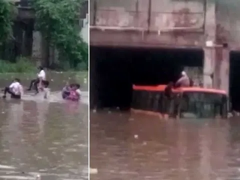 Cops rescue school children trapped in waterlogged underpass - YouTube