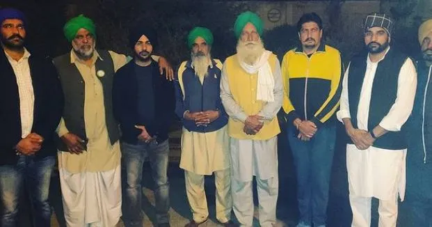 inside pic of gurwinder with farmer