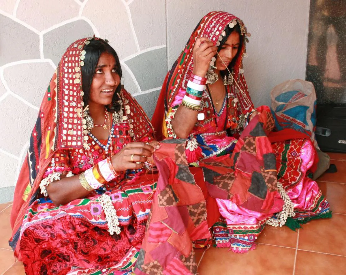 Women doing lambani art