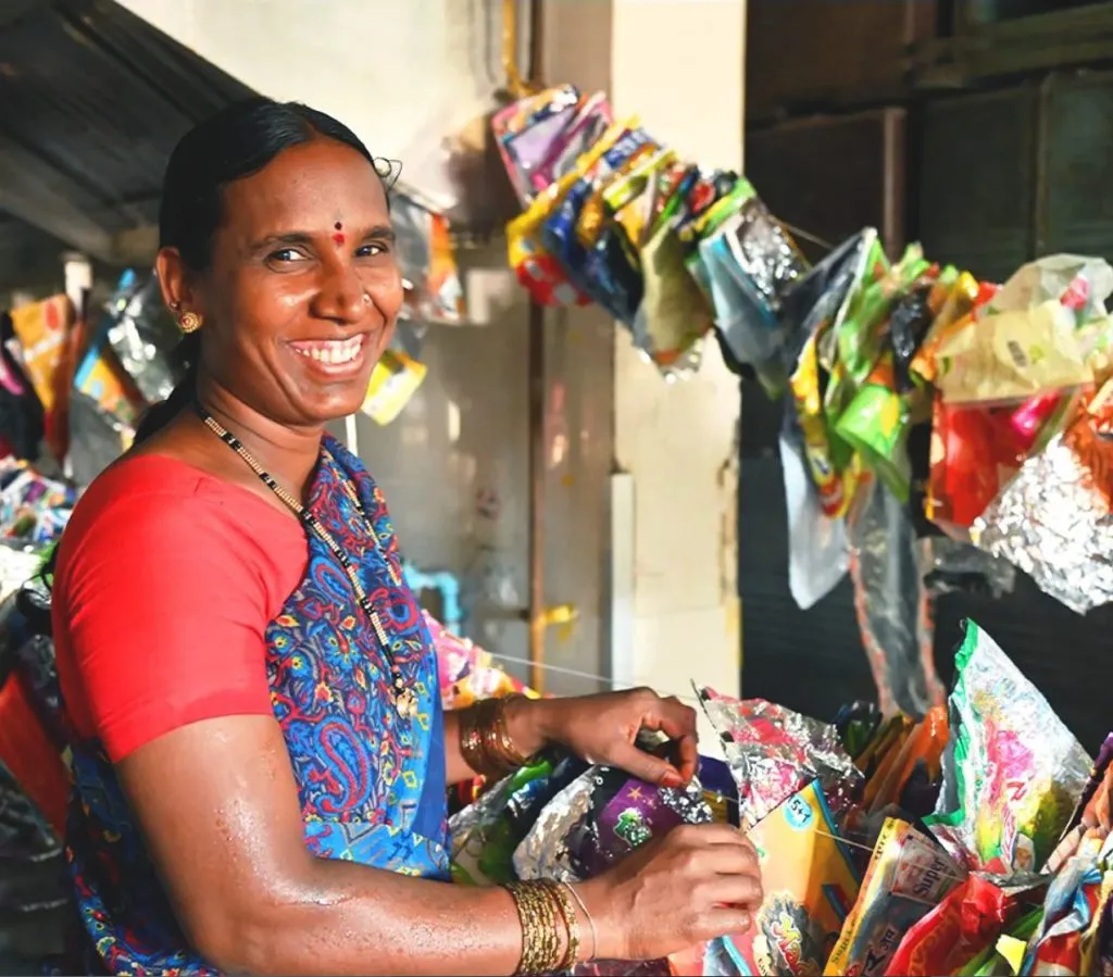 women collecting plastic