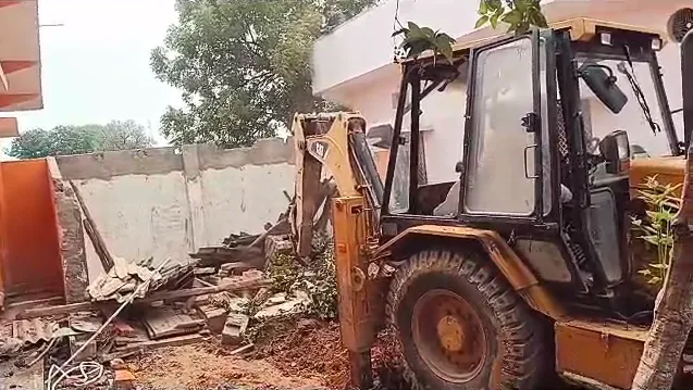 bulldozer demolishes
