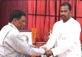Tanmay Patnaik (Right) receives the man of the match from MCC office-bearer Prakash Chandra Das 