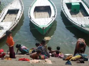 Women washing clothes on the ghats of Ganga in Varanasi -IANS pic