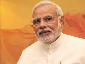 Prime Minister Narendra Modi shakes hands with Reserve Bank of India (RBI) Governor Raghuram Rajan during a meeting in New Delhi on June 1, 2014. (Photo: IANS)