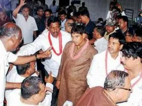 Angry sevayats arguing with ministers at the meeting