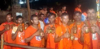 Devotees patiently waiting for their turn to pour water on the Shiva Linga at the Lingaraj Temple in Bhubaneswar on the first Monday of Shravan. (Pix: Biswaranjan Mishra)