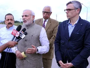 PM Modi talking to media persons in Jammu.  J&K CM Omar Abdullah and Union minister Jitendra Singh  accompanied the PM ( PIB)