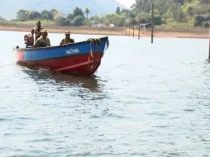 Security personnel on patrol in Gurupriya river
